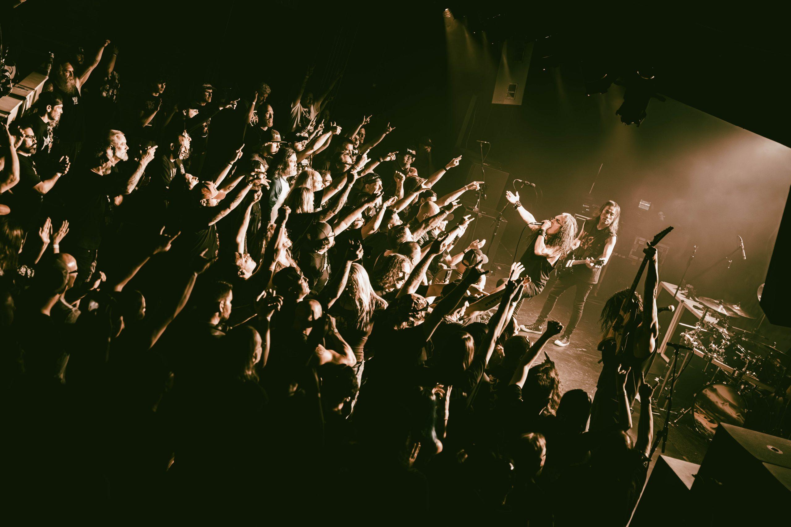 Death Angel performing to a packed crowd at Moxi Theater