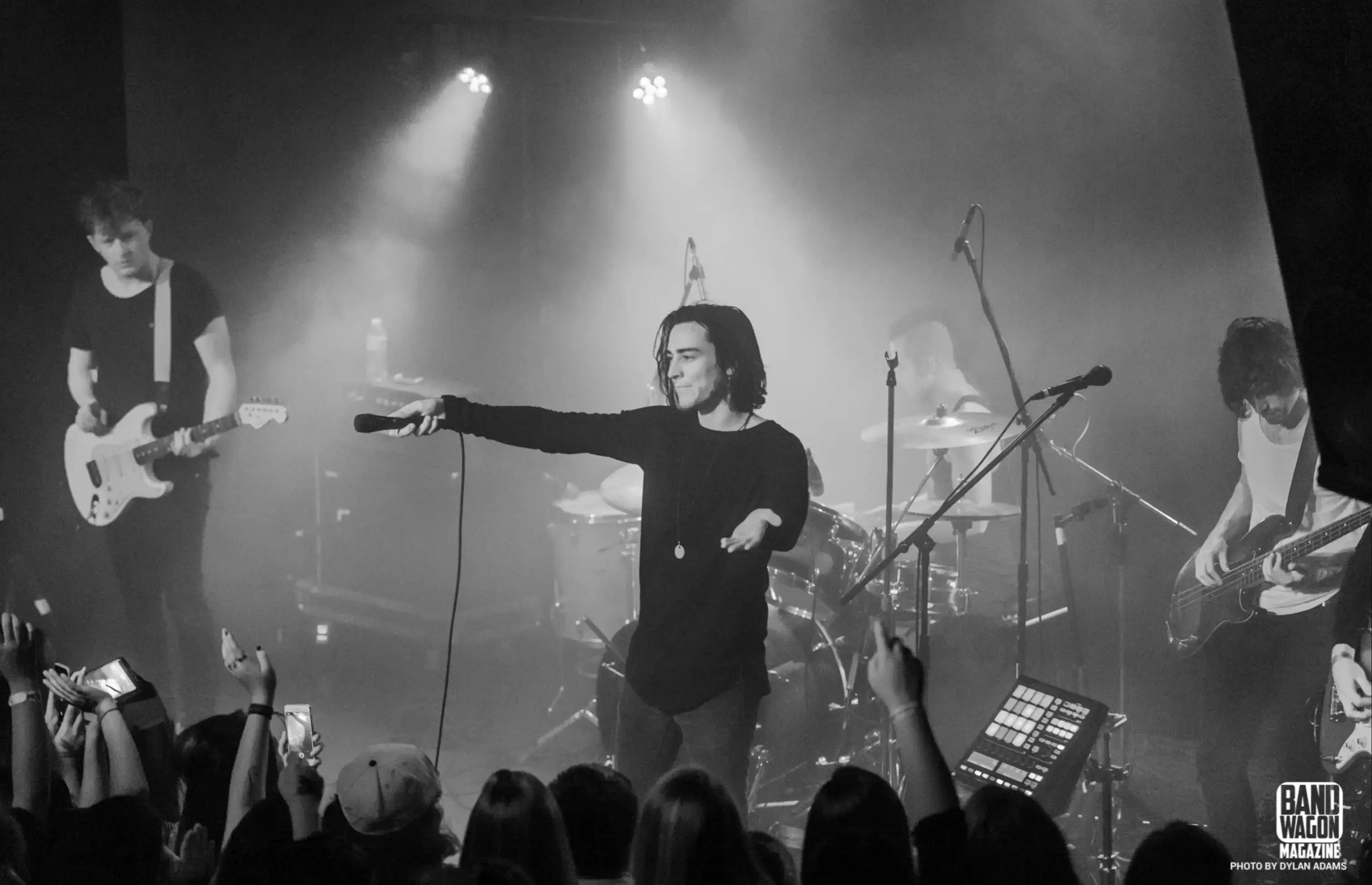 A band performing in black and white at Moxi Theater