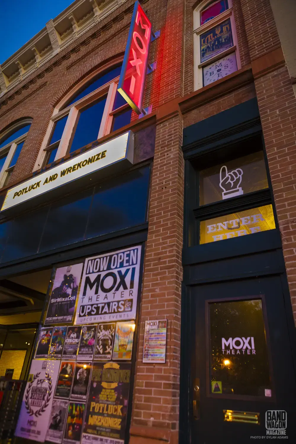 The Moxi Theater neon sign and entrance on 9th Street